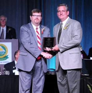 The photo includes Greg Blonde, University of Wisconsin-Extension Agriculture Agent from Waupaca County(right), receiving the National Association of County Agriculture Agents (NACAA) Distinguished Service Award from Mike Hogan, NACAA President from Ohio State University Extension.